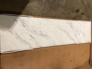 lot 26 image: Hampton Bay 8 ft Straight Laminate Countertop Kit Included in Gloss Calcutta Marble customer return see pictures