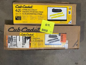lot 121 image: Lot of assorted Cub Cadet mulching kits various models and conditions customer returns see pictures