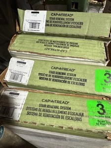 lot 45 image: Lot of 4 cases Cap A Tread Useppa Island OakFirview LookoutGrovetown 47 in. L x 7.37 in. W x 12.7 mm T Vinyl Overlay Stair Reversible Riser customer return see pictures