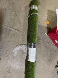lot 56 image: Lifeproof with Petproof Technology Premium Pet Turf 7.5 ft. x 10 ft. Green Artificial Grass Rug Customer Returns See Pictures