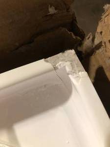 lot 118 image: Streamline 60 in. L x 36 in. W Alcove Acrylic Shower Pan Base in Glossy White Damaged corner Customer Returns See Pictures