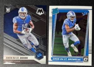 lot 127A image: 2-Card 2021 Amon-Ra St. Brown Detroit Lions Rookie Football Card Lot