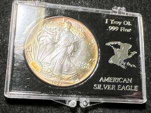 lot 26 image: 1987 AMERICAN SILVER EAGLE 1 TROY OZ .999 FINE SILVER IN CASE