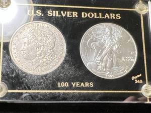 lot 64 image: 1899-O US MORGAN SILVER DOLLAR WITH 1999 AMERICAN SILVER EAGLE IN CASE