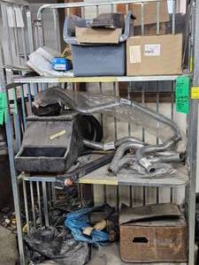 CONTENTS ON CART ONLY- MAINLY NEW DEFENDER PARTS, EXHAUST PIPES, HEADLAMP, HARDWARE, ETC.