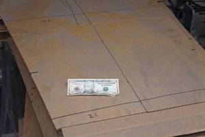 lot 152 image: $10 and  Pallet of Cardboard Sheets
