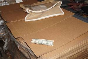 lot 156 image: $10 and  Pallet of Cardboard Sheets