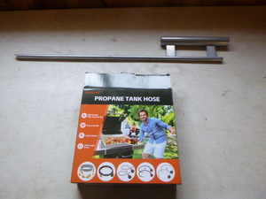 lot 17 image: Propane Tank Hose and Flag Pole Holder