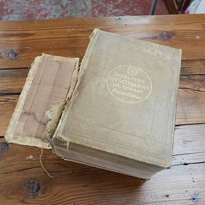 lot 34 image: 1935 Vintage Websters New International Unabridged Dictionary � Heavy � Binding needs repair but pages are in good condition -  5.75 inches thick