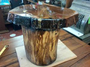 lot 105 image: Real Wood Crafted Stool Thick Slab Seat heavily lacquered with faux gemstone inlay 15 inches wide and tall