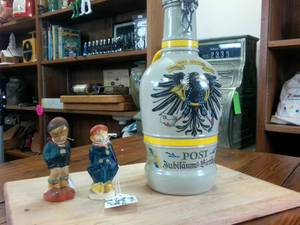 lot 106 image: Vintage Ceramic Beer Growler with handle and two vintage bavarian figurines.