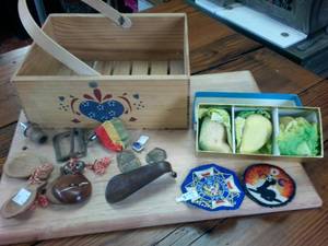 lot 113 image: Basket Mash up of stuff � Gold Bond Shoe horn � medals patches castenets Vintage belt buckle with carry case