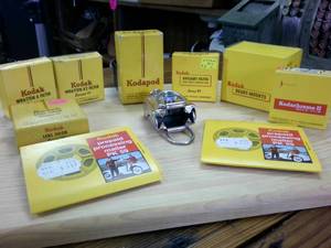 lot 153 image: Large Lot of Vintage Kodak Kodachrome � Filters � Slide Mounts � Kodapod adapter � prepaid mailer for film processing � daylight filter  (box only)
