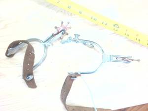 lot 221 image: Stirrups with copper colored spurs