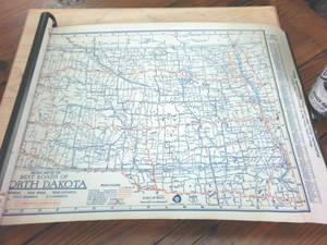 lot 246 image: Vintage Best Roads of North Dakota � self rolling scroll in hangable metal case � Pathfinder auto map company -