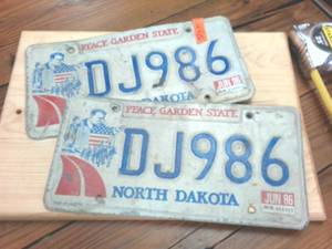 lot 284 image: North Dakota Embossed Vintage License Plates Matching Set � Mid 80s