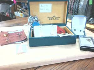 lot 289 image: Rolex Box (real) with sets of earrings � hat pins -  and Owl Piece