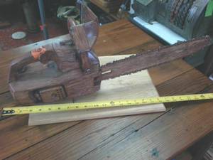 lot 382 image: Chainsaw Painted to Look Like its Wooden