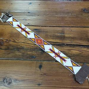 lot 403 image: Unfinished seed bead work from a loom � unknown artist � 20.5 inches of beadwork by 2 inches -