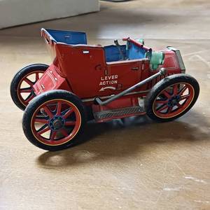 lot 164 image: Wind up Vintage Tin Toy Lever Action Car