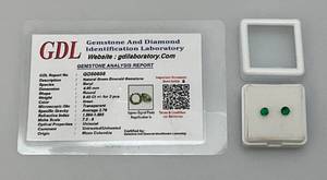 lot 133 image: GDL Gemstone And Diamond Identification Laboratory Natural Green Emerald Round 4.00 MM Gemstone With Card