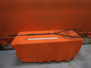 lot 104 image: Fishing Net & Measuring Stick