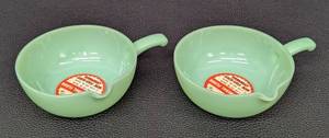 lot 108JT image: Two Vintage Fire King Jadeite Single Spout Skillet Bowls