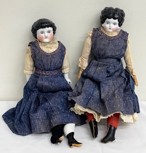 lot 8MO image: Pair of Antique Dolls in Handcrafted Denim Dresses with Extra Outfits
