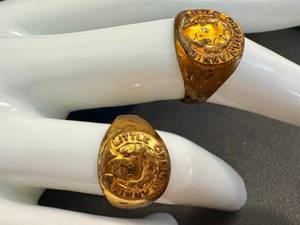 lot 47JT image: Two Vintage Gold-Tone Orphan Annie Rings