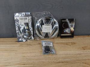 lot 297 image: Volkswagen Emblem, Chevrolet Key Chain & Caps, BMW Tire Valves - Brand New