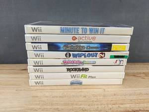 lot 56F image: 8 Nintendo Wii Games - Wipeout, Hello Kitty Seasons, Rock Band, Wii Fit Plus, and Skylanders Spyros Adventure C