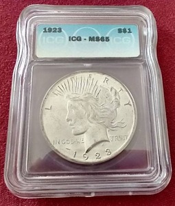 lot 99 image: 1923 Peace Dollar - ICG MS65