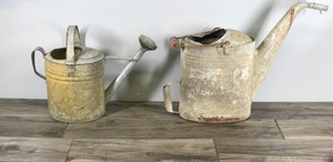 lot 275 image: 2 - Vintage Metal Watering Cans - One has a wooden handle