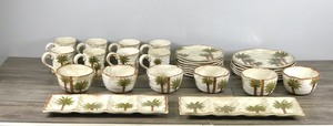 lot 300 image: 30 Piece Dinnerware Set - Tabletops Unlimited Fiji Palm Tree Hand Painted Dish ware Set