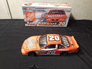 lot 35 image: Action Tony Stewart #20 die cast Nascar race car bank with key. 1 of 3600