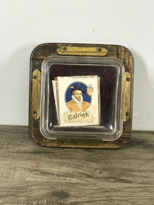 lot 342 image: Vintage Raleigh Cigarettes Ashtray - Glass Top, Wood Base and Metal Plate on Back