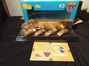 lot 52 image: 50th Anniversary Nascar Racing Champions Special Collectors Edition of 24k Gold plated Transporter and 24k Gold plated Legend Stockcars with signature and certificate of authenticity with Richard Pettys signature