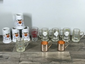 lot 190 image: Lot of Collectible Beer Mugs  Glasses & More - Lakemaid Beer Schells & Rapala - Schmidt Beer Collector Series with Fish on them - Smirnoff Mule Copper Cups - New Zealand Steinlager Beer Mugs - Usingers Milwaukee Sausage Beer Mugs