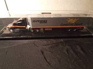 lot 135 image: Genuine Draft Penki Racing die cast Race car transporter