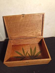 lot 159 image: Wood box with marijuana leaves decoupaged on inside bottom