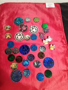 lot 164 image: Lot of Pokemon trading coins and pins