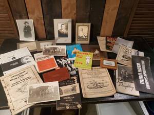 lot 44 image: Vintage Manuals paperwork wallets and photos