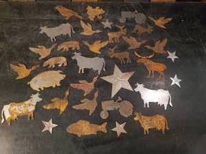 lot 55 image: Large Lot of Metal Cutouts of Various Themes, Cows, Stars, fish and so many more