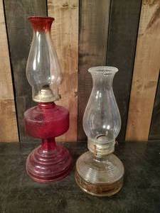 lot 71 image: Beautiful Oil Lamps,  one gorgeous Red and the other beautiful clear Glass