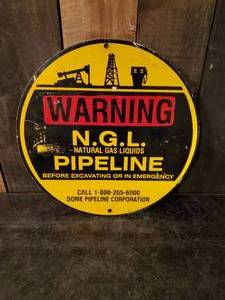 lot 73 image: Round Metal Sign Warning N.G.L Pipeline Approx 12 round