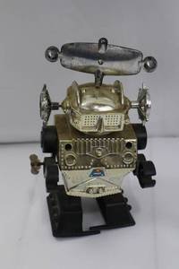 lot 149 image: Robot Tin Wind-Up Toy on Display Base - Vintage Space Explorer, 1950s
