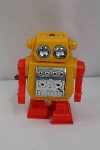 lot 161 image: Vintage Yellow Robot Toy - Red Arms, 6-Inch Plastic Figure