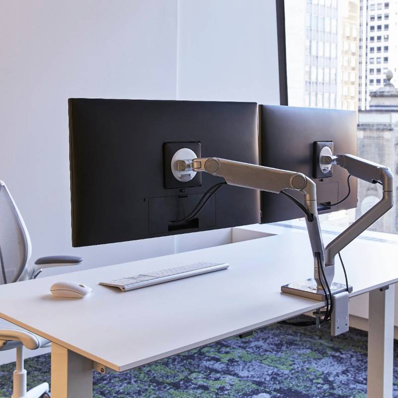 lot 30 image: MSRP $900 NEW High Quality Humanscale M2.1 Dual Mount Lightweight Adjustable Monitor Arms Sleek White &amp Chrome Finish -lighter, thinner &amp greater dynamic range than any current monitor arm on the market - 15 Year Warranty (Monitors Not Included)