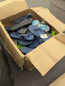 lot 56 image: Large box of Mixed Flip Flops