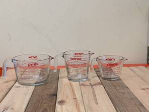 lot 69 image: (3) PYREX MEASURING CUPS